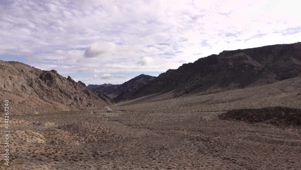 Looking into large desert valley wide open area.
Looking into large desert valley wide open area.