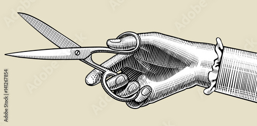 Woman's hand with scissors
