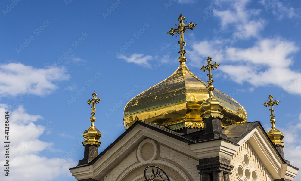 Domes of Kiev Pechersk Lavra against the background of a cloudy sky