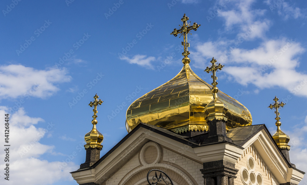 Domes of Kiev Pechersk Lavra against the background of a cloudy sky Domes of Kiev Pechersk Lavra against the background of a cloudy sky