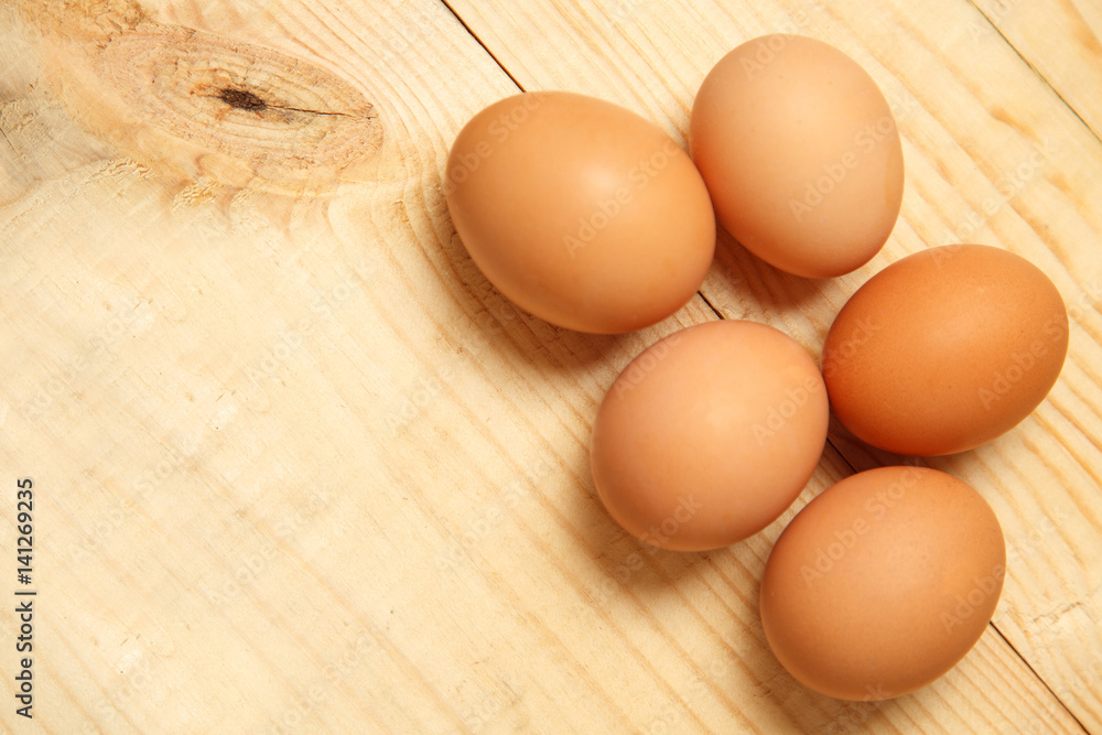 Eggs lay on wooden background. Food ingredient. Eggs lay on wooden background. Food ingredient.