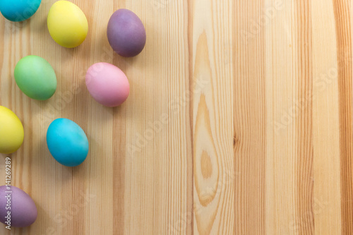 Painting easter eggs on the wooden background