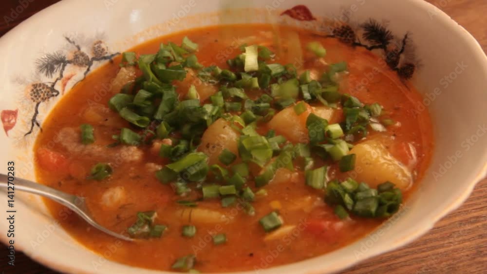 fill sliced green onions, stewed potatoes in a bowl fill sliced green onions, stewed potatoes in a bowl