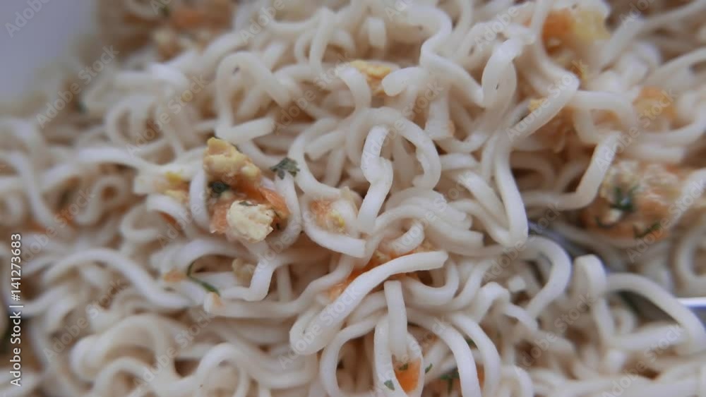 Closeup of ramen noodles with sauce and sausage. 4K UHD Closeup of ramen noodles with sauce and sausage. 4K UHD