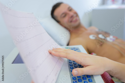 Patient attached to heart monitor