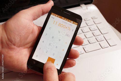 To calculate percent on the calculator in phone