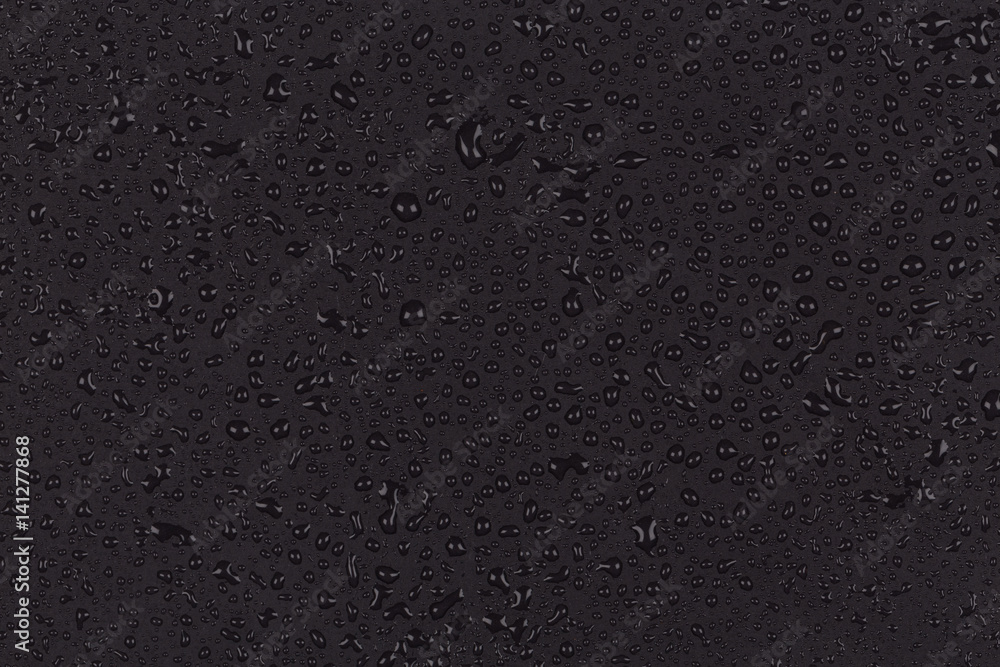 Water drops on dark stone Water drops on dark stone