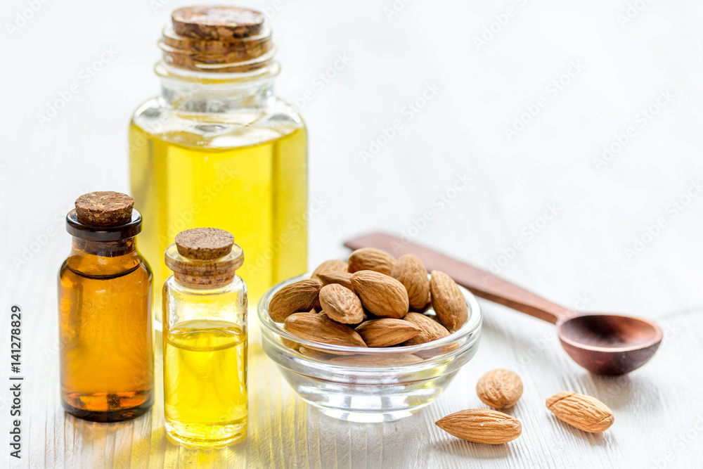 organic cosmetic with almond extract on table background organic cosmetic with almond extract on table background