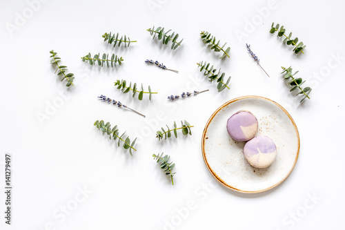 woman breakfast with lavander and eucalyptus on white table top view