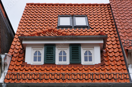 Tiled mansard roof of medieval building in Bremen, Germany.