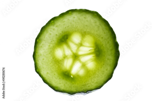 Cross section slice of fresh cucumber isolated on white