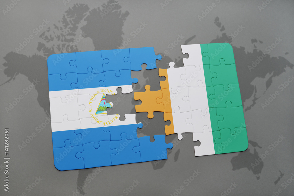 puzzle with the national flag of nicaragua and cote divoire on a world ...