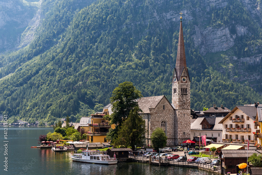 Hallstatt church with lake and mountain background in summer
