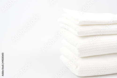 White cotton towels use in spa bathroom on the background.