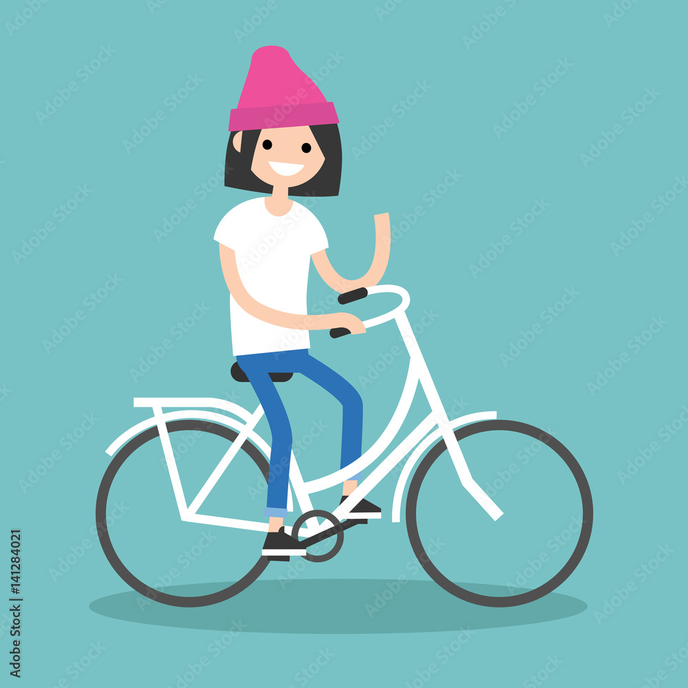 Fototapeta premium Young brunette girl riding a bike and waving her hand / editable flat vector illustration, clip art