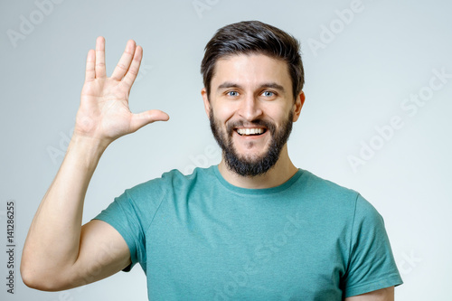Tableau sur toile Man making Vulcan salute isolated