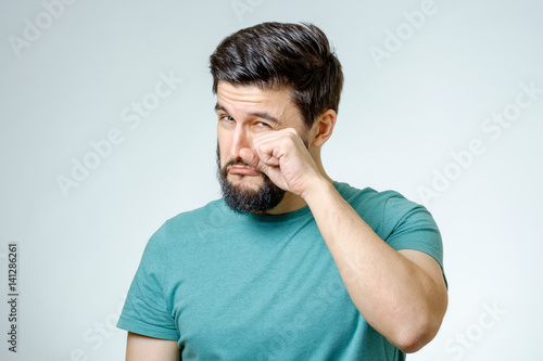 Portrait of man is crying isolated
