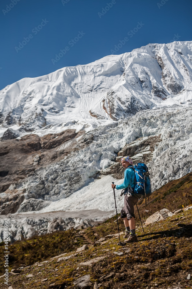 Trekker in front of Manaslu glacier on Manaslu circuit trek in Nepal