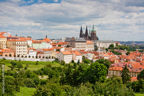 Aerial view of the city. St. Vitus Cathedral over old town red roofs. Prague, Czech Republic © Oleg Totskyi