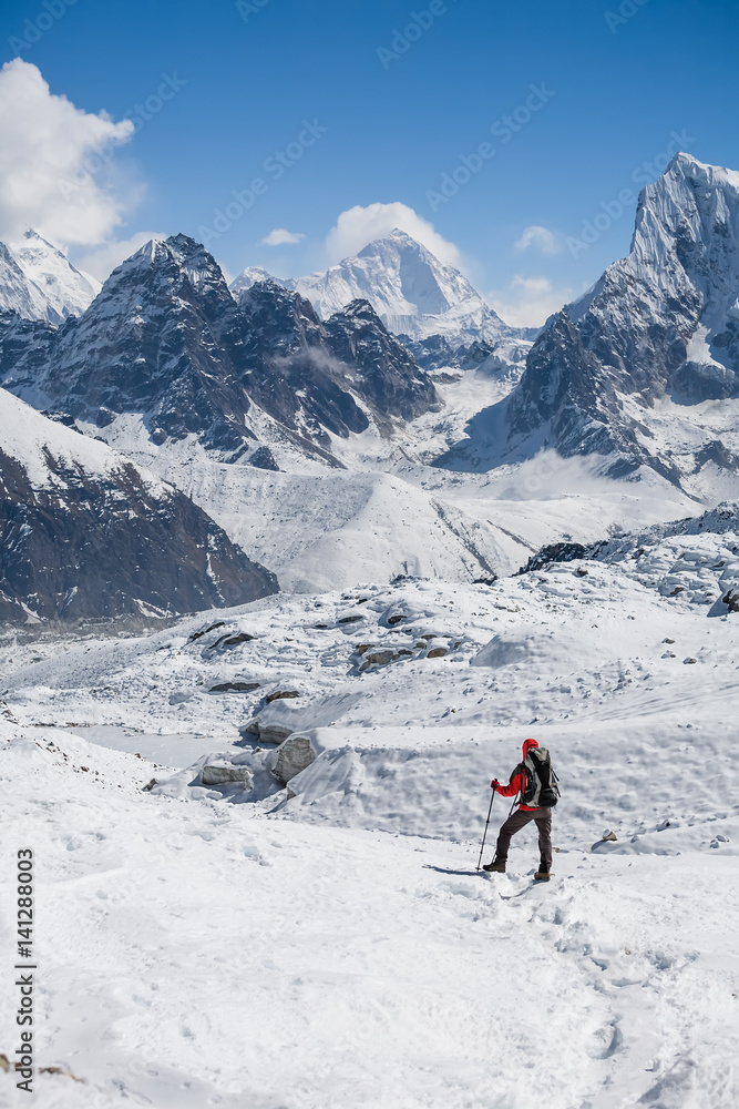 Trekker is walking by Renjo La pass in Everest region