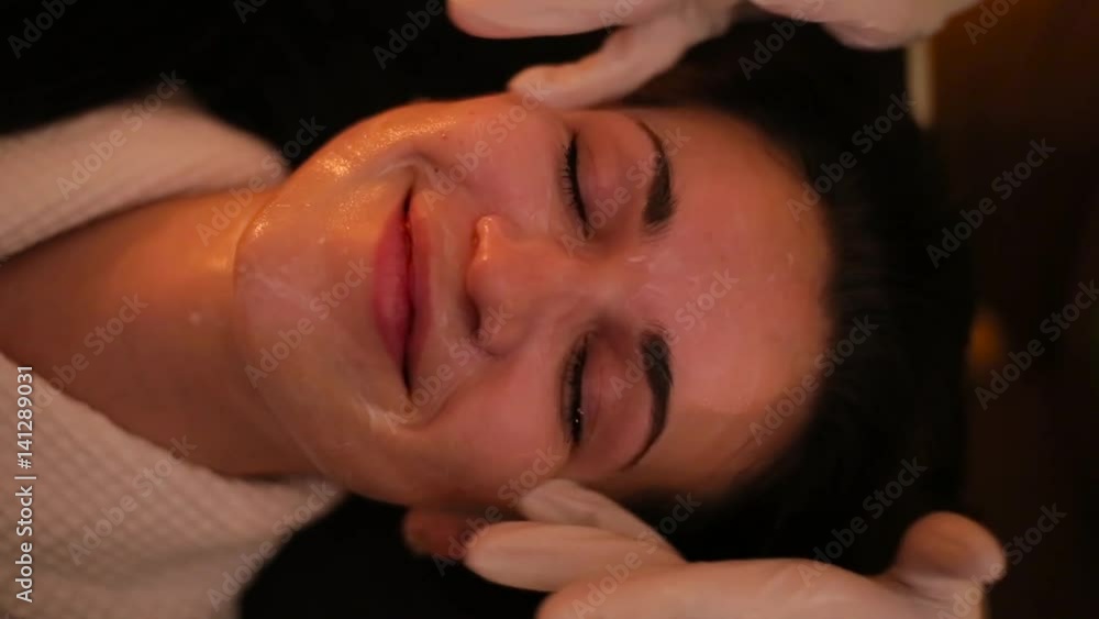 The girl is smeared with cream in the face in the beauty salon. The girl is smeared with cream in the face in the beauty salon.