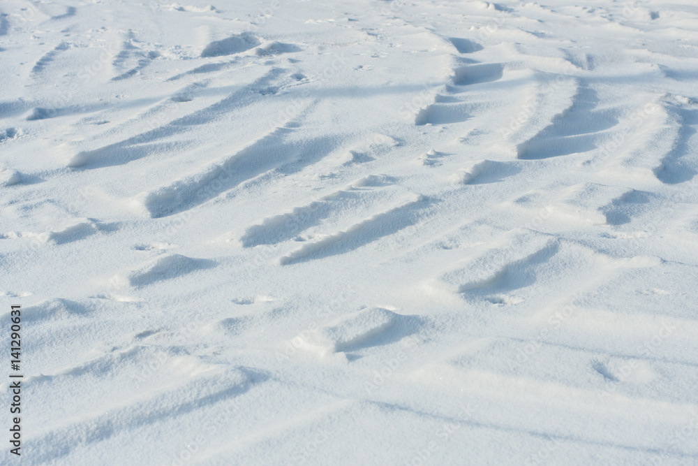 Curvy car track in the snow background Curvy car track in the snow background