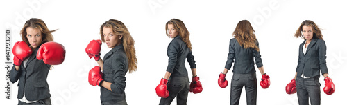 Young woman with boxing gloves isolated on white © Elnur