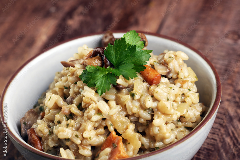 risotto with mushrooms, fresh herbs and parmesan cheese. risotto with mushrooms, fresh herbs and parmesan cheese.