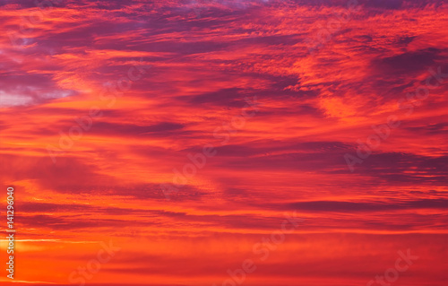 Beautiful fiery orange sky during sunset or sunrise. © es0lex