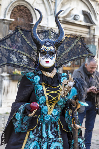 VENICE, ITALY - February 25, 2017:  devil  mask at St Mark square during the Carnival of Venice