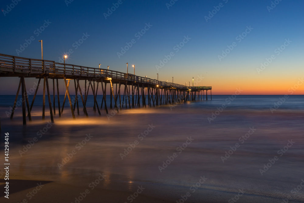 Sunrise on Long Wooden Fishing Pier