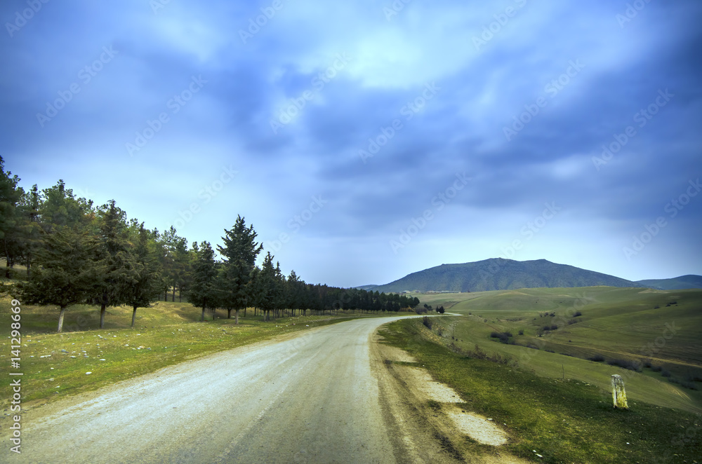 Majestic sunset in the mountains landscape. Dramatic sky clouds. Azerbaijan, Gazakh Big Caucasus