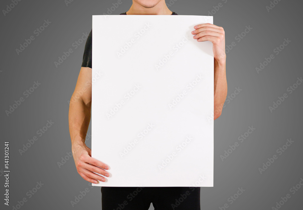 Man showing blank white big A2 paper. Leaflet presentation. Pamphlet hold  hands. Man show clear offset paper. Sheet template. Booklet design sheet  display read first person. Stock-Foto | Adobe Stock