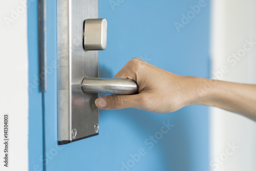 hand hold handle of door, close up