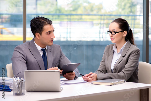 Businesspeople having discussion in the office © Elnur