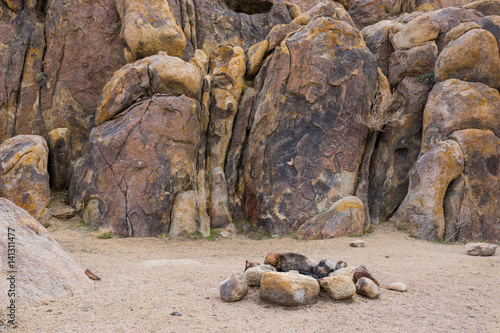 Round circle of stones form camp fire in a pile of boulders.