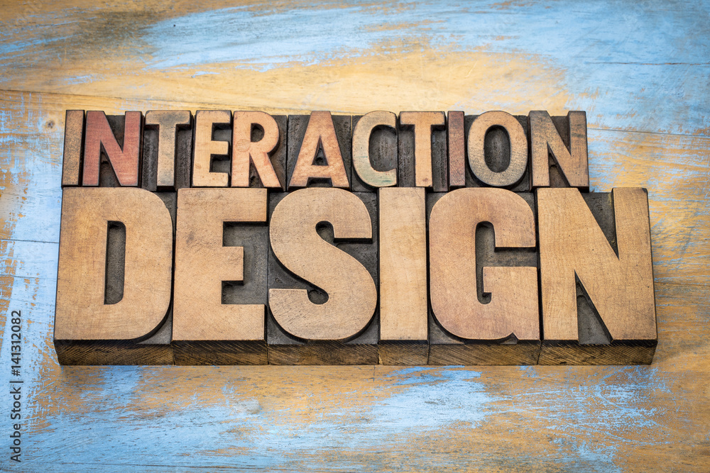 interaction design word abstract in wood type - obrazy, fototapety, plakaty 