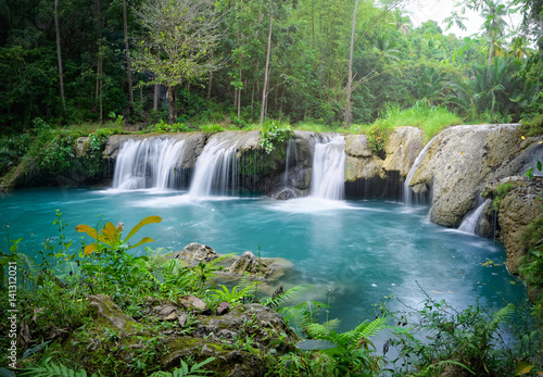 Deep rainforest waterfall  National Park. © soft_light