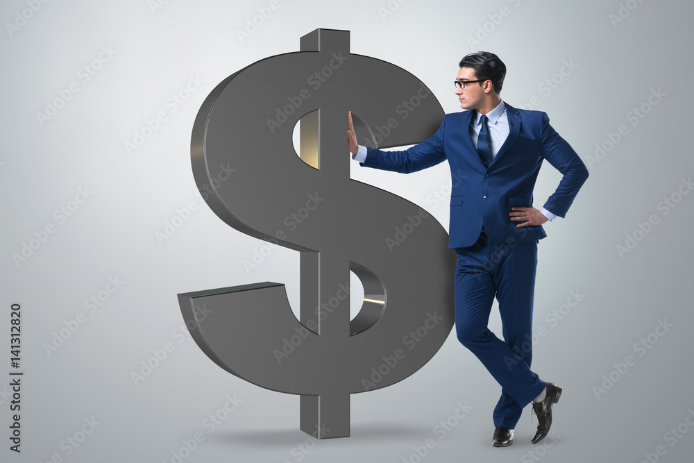 Businessman next to dollar sign Businessman next to dollar sign
