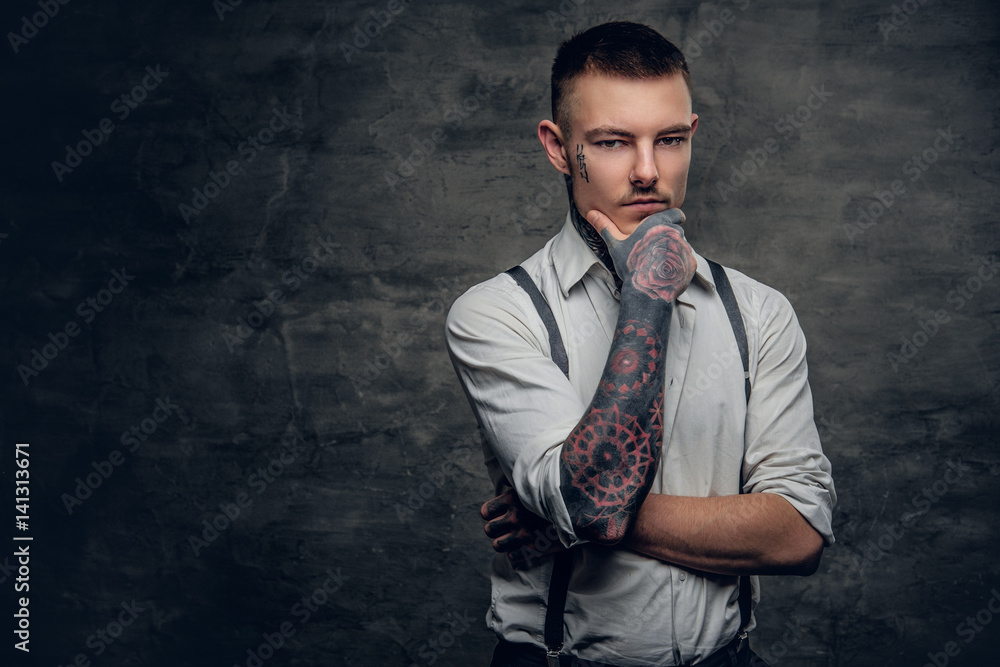 A man wearing white shirt and suspenders. A man wearing white shirt and suspenders.