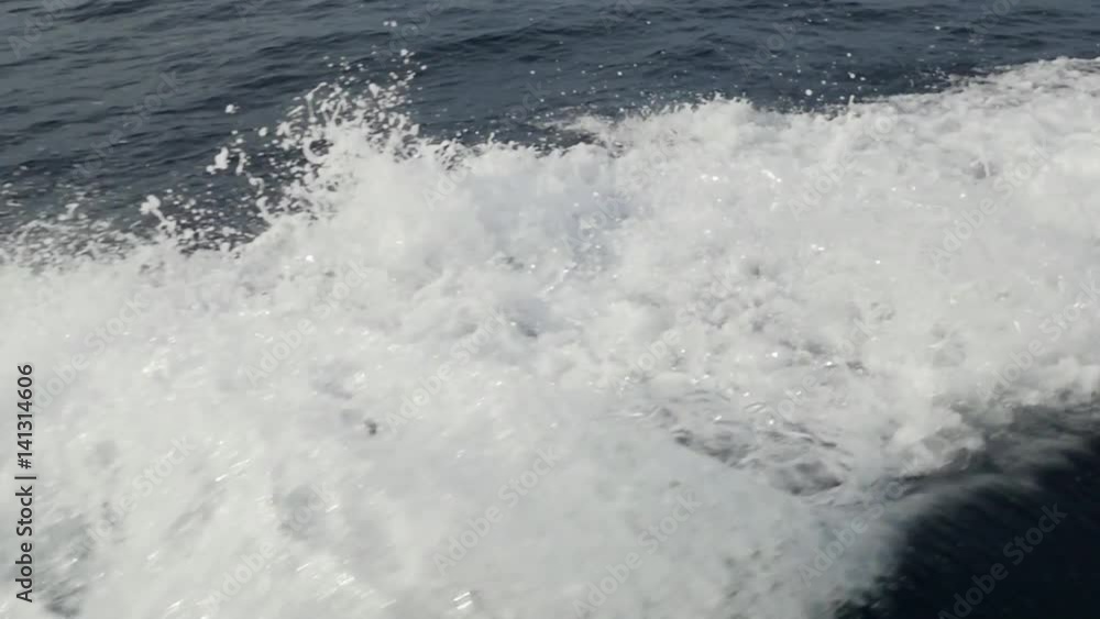 Waves from a motor boat against a background of the sea horizon in Indonesia. Cruise on the blue water. Extreme sport. Speed Regatta. Waves from a motor boat against a background of the sea horizon in Indonesia. Cruise on the blue water. Extreme sport. Speed Regatta.
