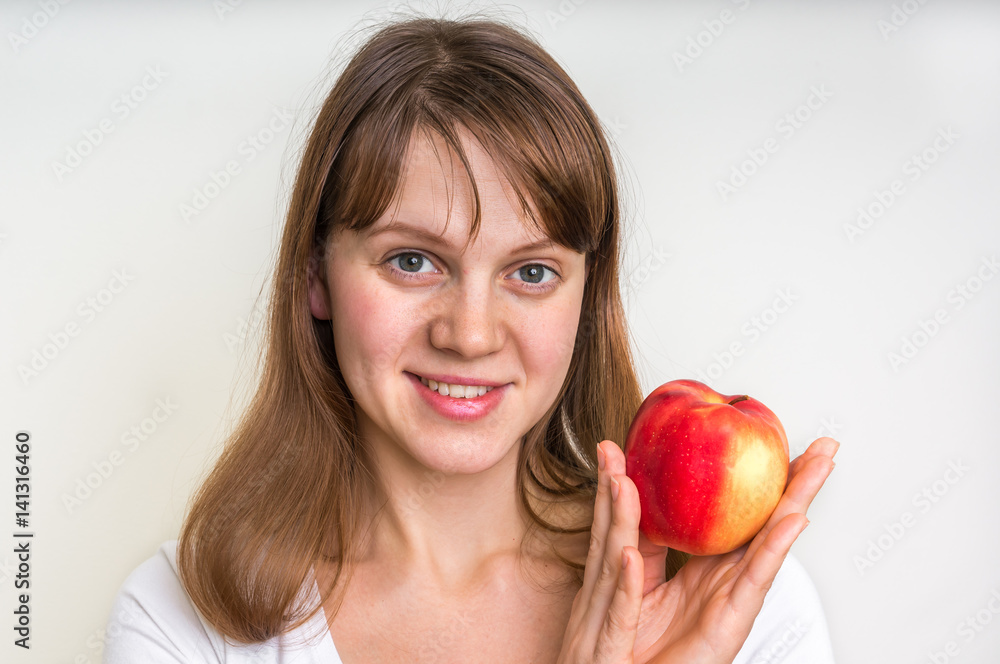 Woman with apple isolated on white - healthy diet concept Woman with apple isolated on white - healthy diet concept