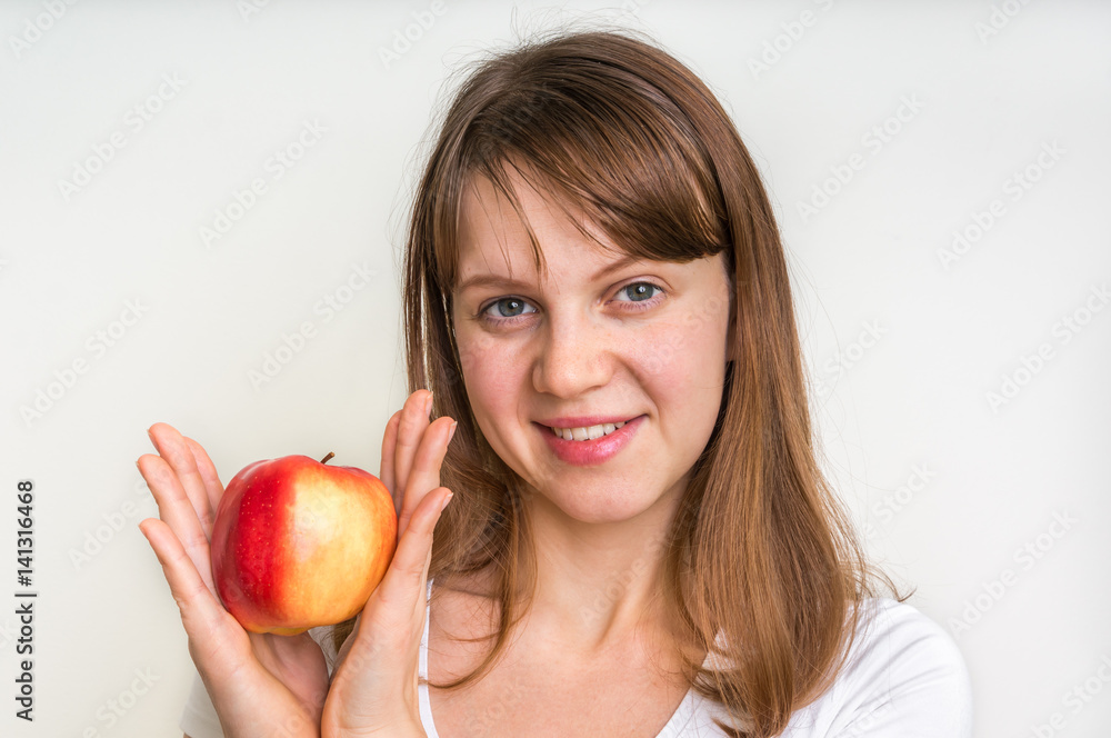 Woman with apple isolated on white - healthy diet concept Woman with apple isolated on white - healthy diet concept