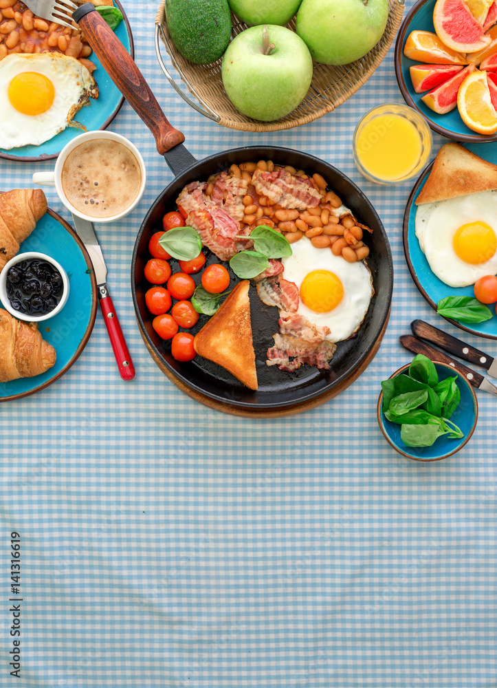 Fried egg, beans, tomatoes, bacon, toast various fruits, juice, coffee Fried egg, beans, tomatoes, bacon, toast various fruits, juice, coffee