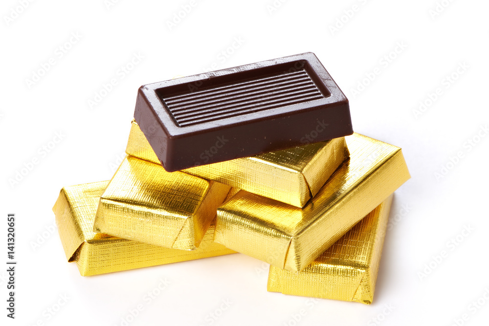 Chocolate in gold wrappers isolated Stock Photo