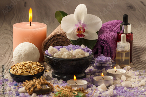 Composition of spa products on the light wooden table