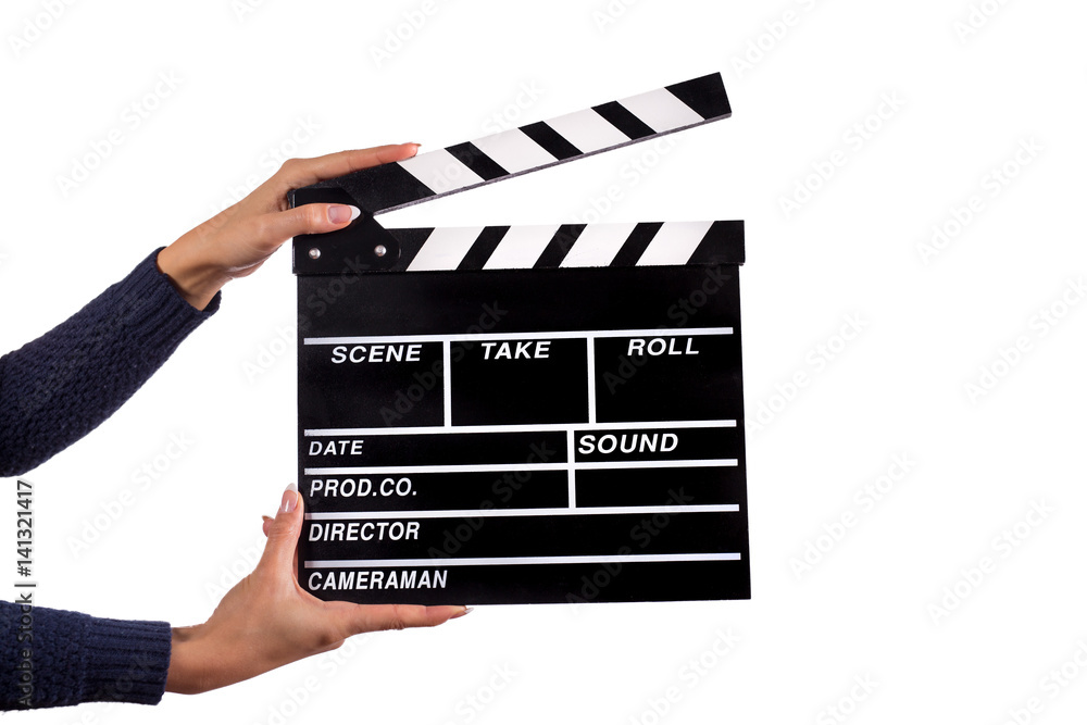Fototapeta premium Clapperboard sign hold by female hands.