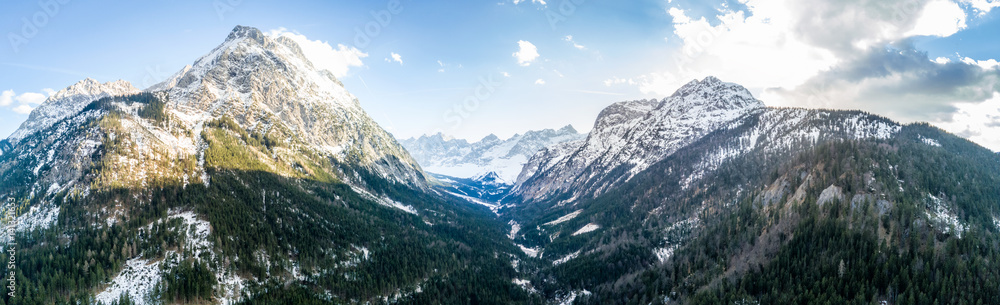 Alpine mountain with panorama view into a valley. Shot with a drone in the Karwendel mountain range
