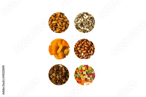 nuts and dried fruit in circles on a white background © Olesia