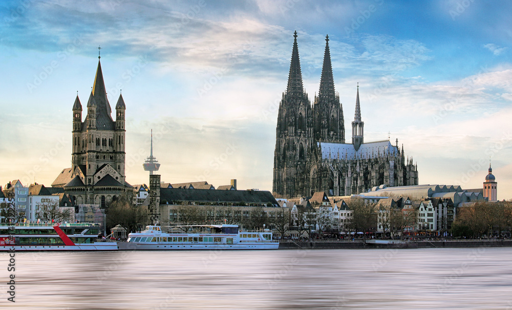 Cologne over the Rhine River with cruise ship in Cologne, Germany. Cologne over the Rhine River with cruise ship in Cologne, Germany.